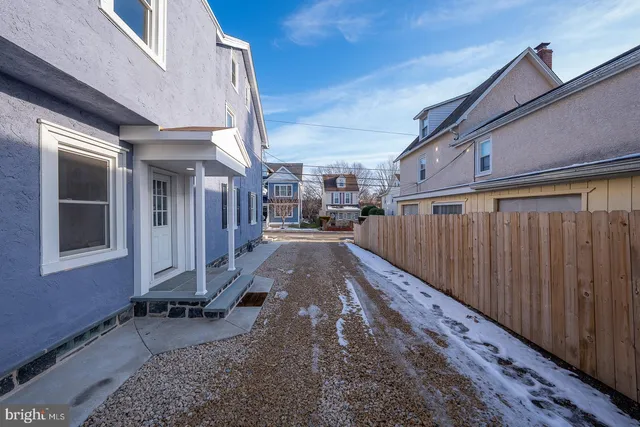 a view of a porch with wooden floor and stairs