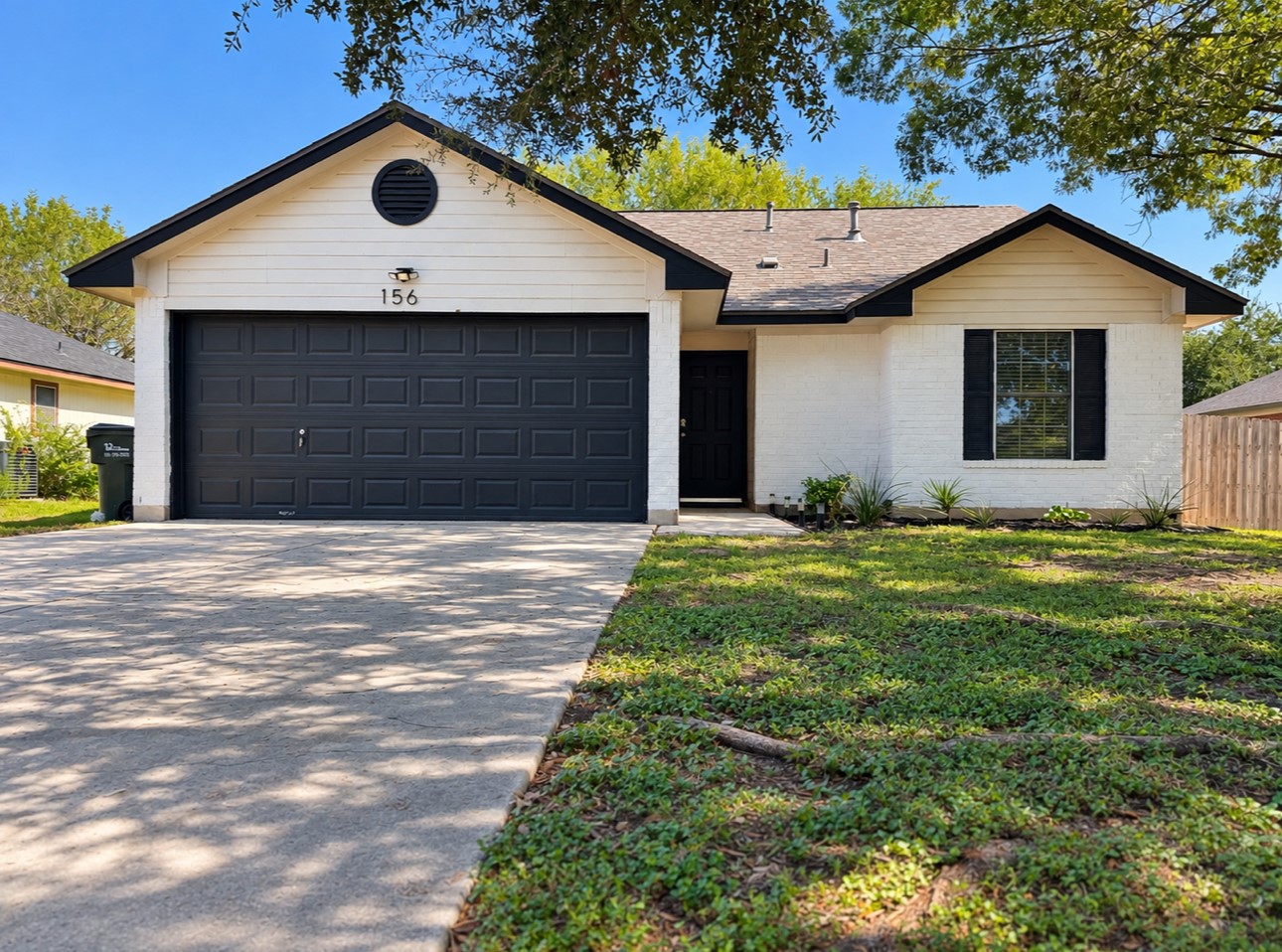 156 Keystone Loop Kyle, TX 78640 - Photo 1 of 23 Crisp masonry siding and a neat shingle roof define this charming single-story facade.