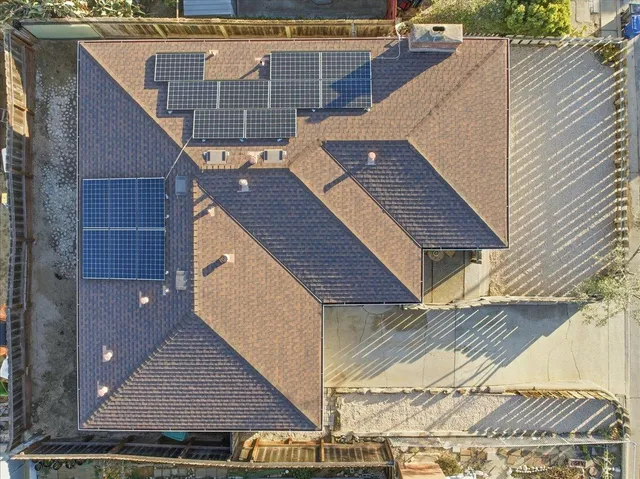 a view of a balcony with wooden floor and fence