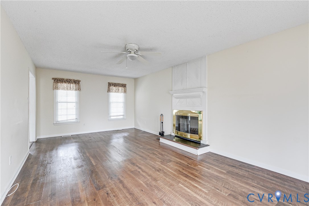 600 Queensway Road Chesterfield, VA 23236 - Photo 14 of 33 a view of an empty room with wooden floor and a window
