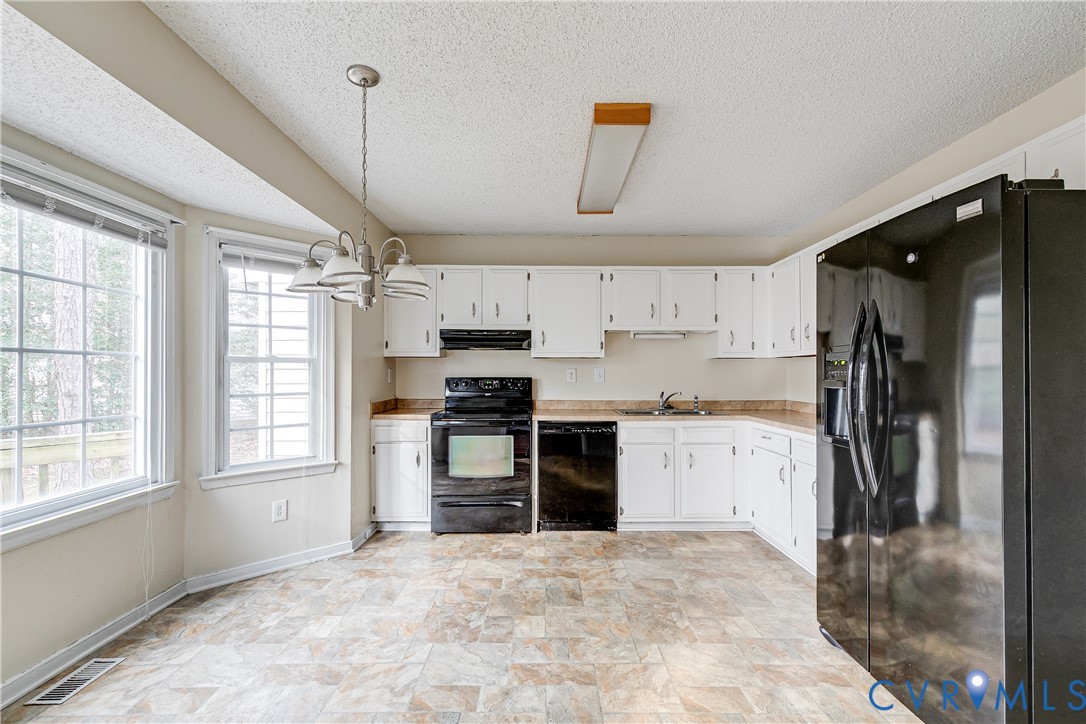 600 Queensway Road Chesterfield, VA 23236 - Photo 16 of 33 a kitchen with stainless steel appliances a refrigerator sink and stove