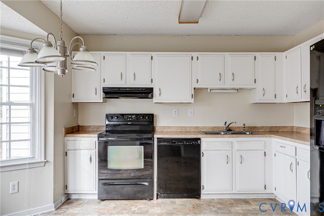 600 Queensway Road Chesterfield, VA 23236 - Photo 18 of 33 a kitchen with stainless steel appliances granite countertop a stove a sink and a refrigerator