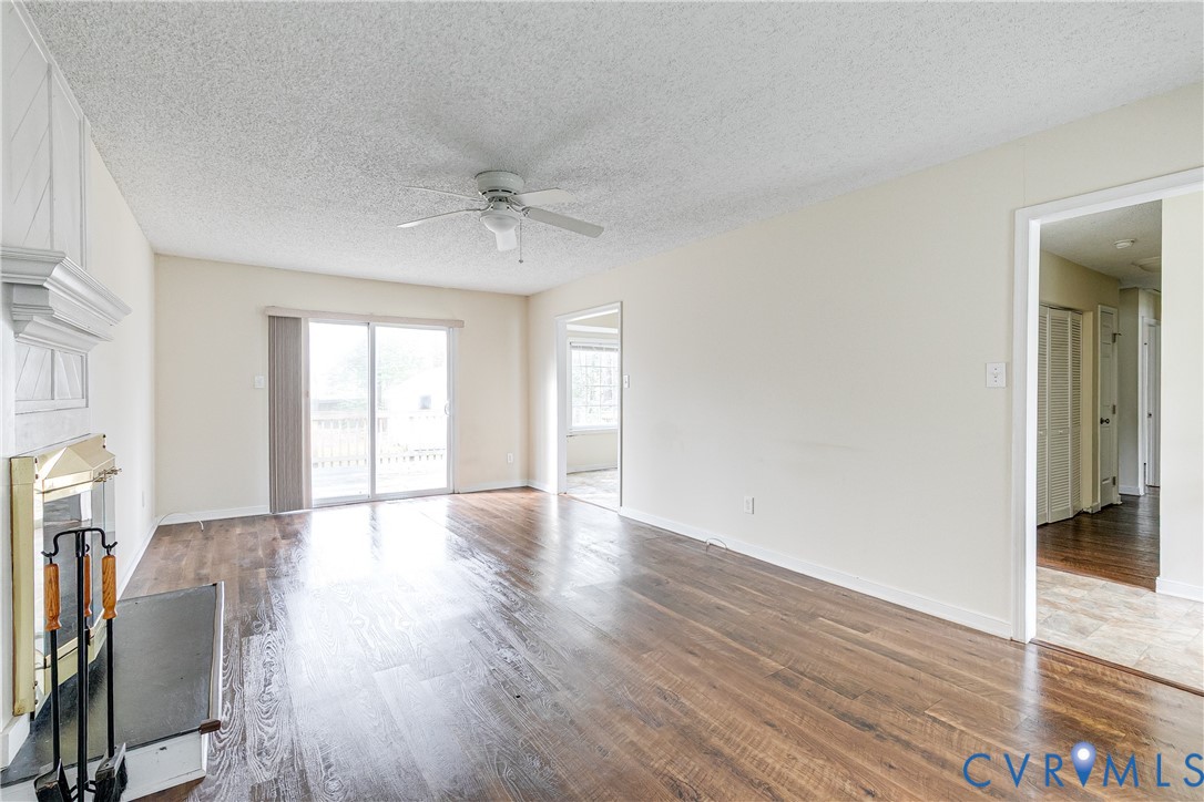 600 Queensway Road Chesterfield, VA 23236 - Photo 2 of 33 an empty room with wooden floor and windows