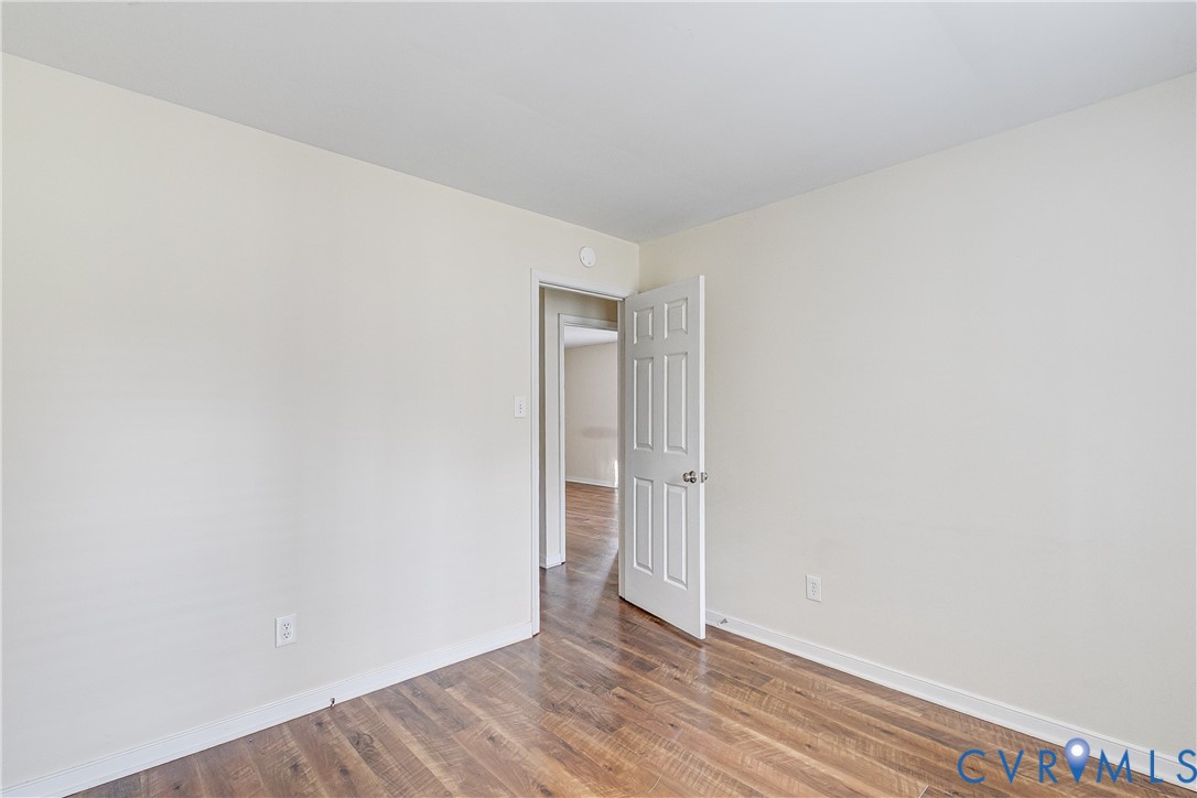 600 Queensway Road Chesterfield, VA 23236 - Photo 22 of 33 a view of an empty room with wooden floor