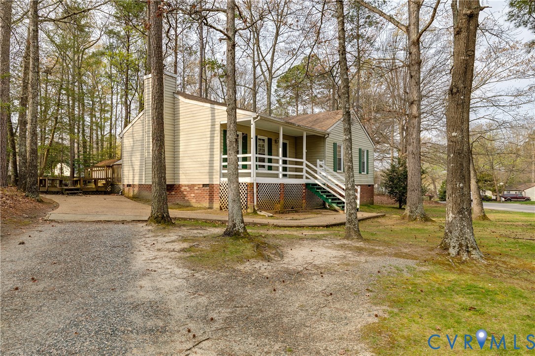 600 Queensway Road Chesterfield, VA 23236 - Photo 8 of 33 a view of a house with cars park side of a road