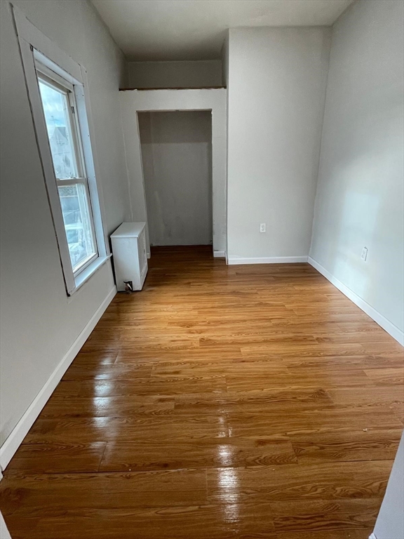 176 Broadway, Unit 2 Methuen, MA 01844 - Photo 6 of 8 a view of room with window and hardwood floor