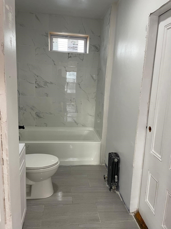 176 Broadway, Unit 2 Methuen, MA 01844 - Photo 7 of 8 a bathroom with a toilet and a shower