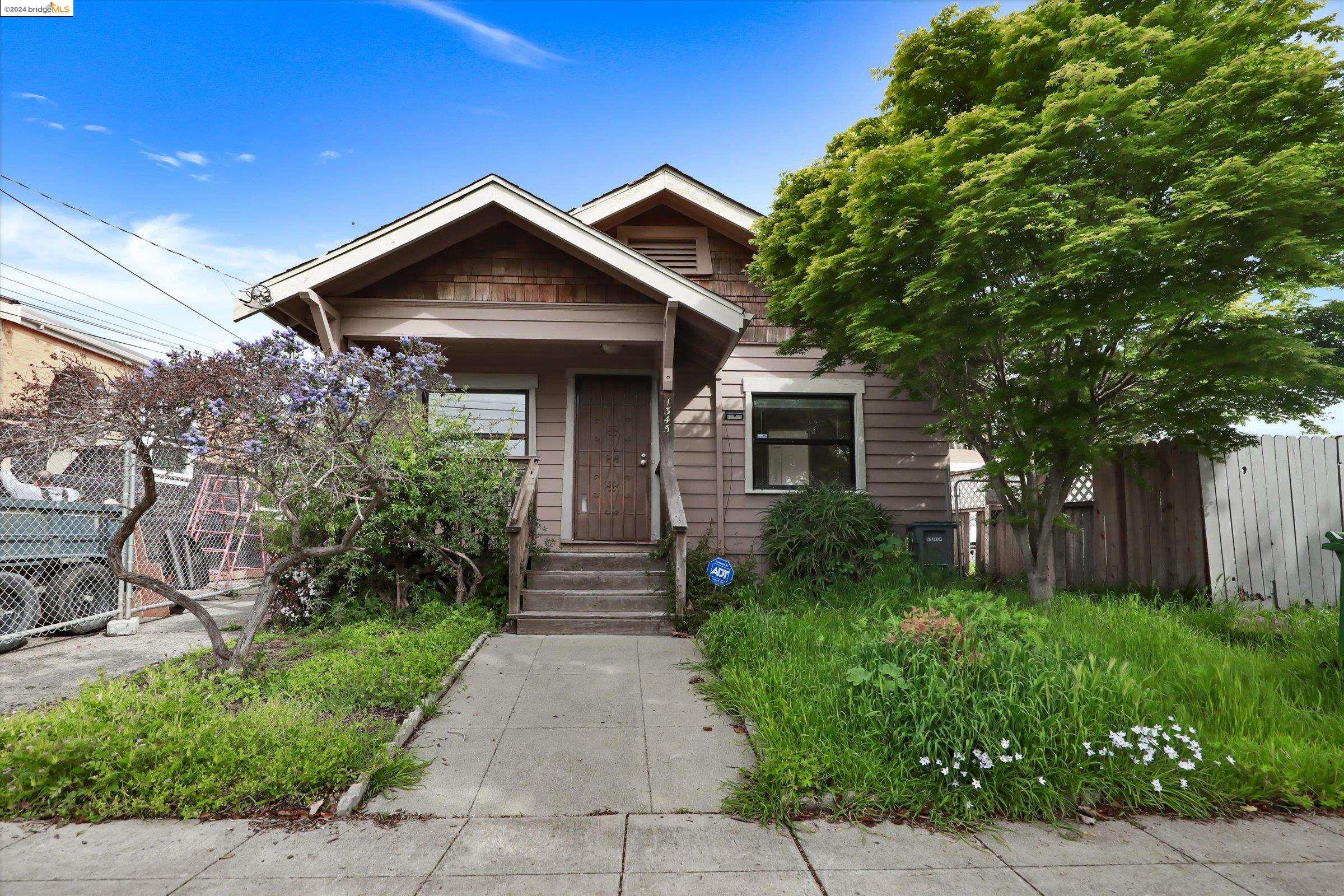 1345 Ward Street Berkeley, CA 94702 - Photo 1 of 1 a front view of a house with garden