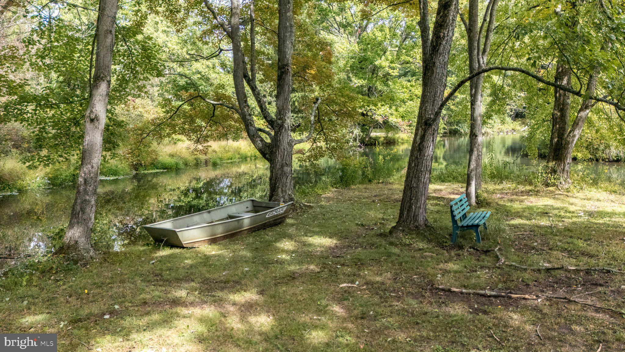 389 Reservoir Road Quakertown, PA 18951 - Photo 67 of 74 Pondside Bench & Boat Ready for Fishing