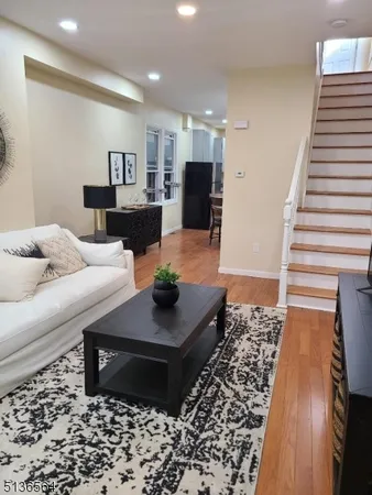 a living room with furniture and a rug