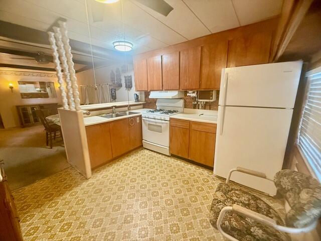 51555 Monroe Street Indio, CA 92201 - Photo 15 of 30 a kitchen with stainless steel appliances granite countertop a refrigerator a stove a sink and a microwave