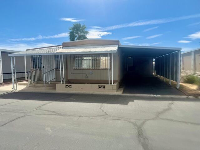 51555 Monroe Street Indio, CA 92201 - Photo 2 of 30 a view of a house with a porch