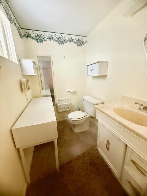 51555 Monroe Street Indio, CA 92201 - Photo 7 of 30 a bathroom with a sink a toilet and shower