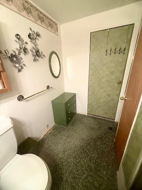 51555 Monroe Street Indio, CA 92201 - Photo 8 of 30 a bathroom with a toilet and a shower