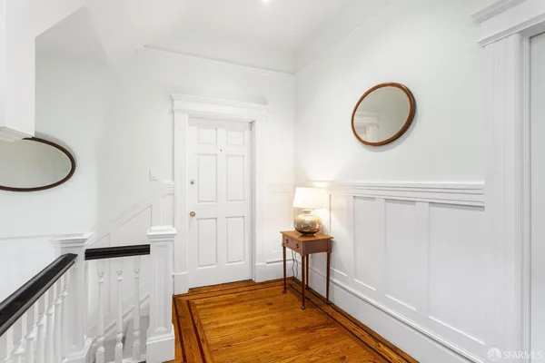 a view of a livingroom with furniture and entryway