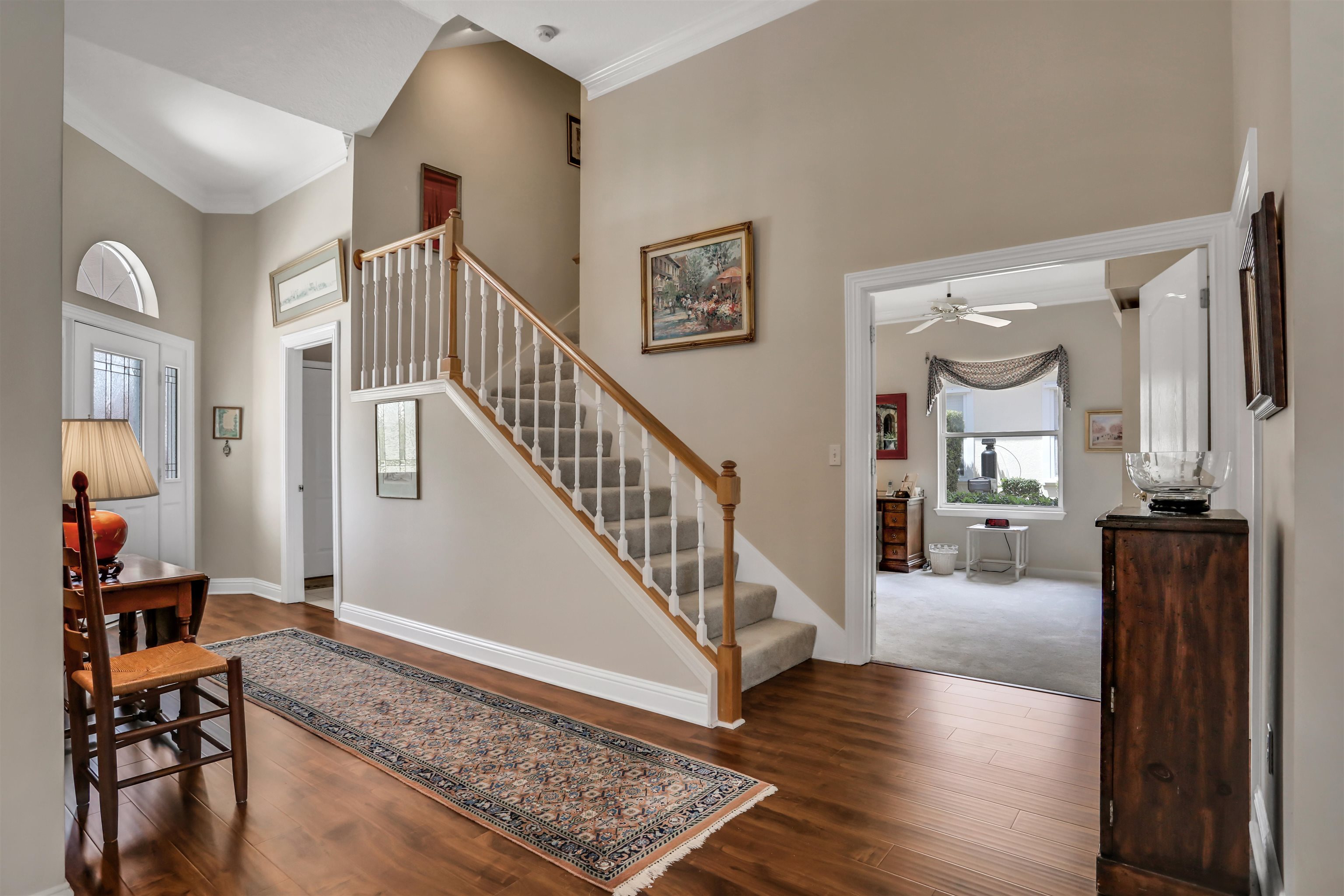 904 Birdie Way St. Augustine, FL 32080 - Photo 11 of 21 a view of a livingroom with wooden floor and furniture