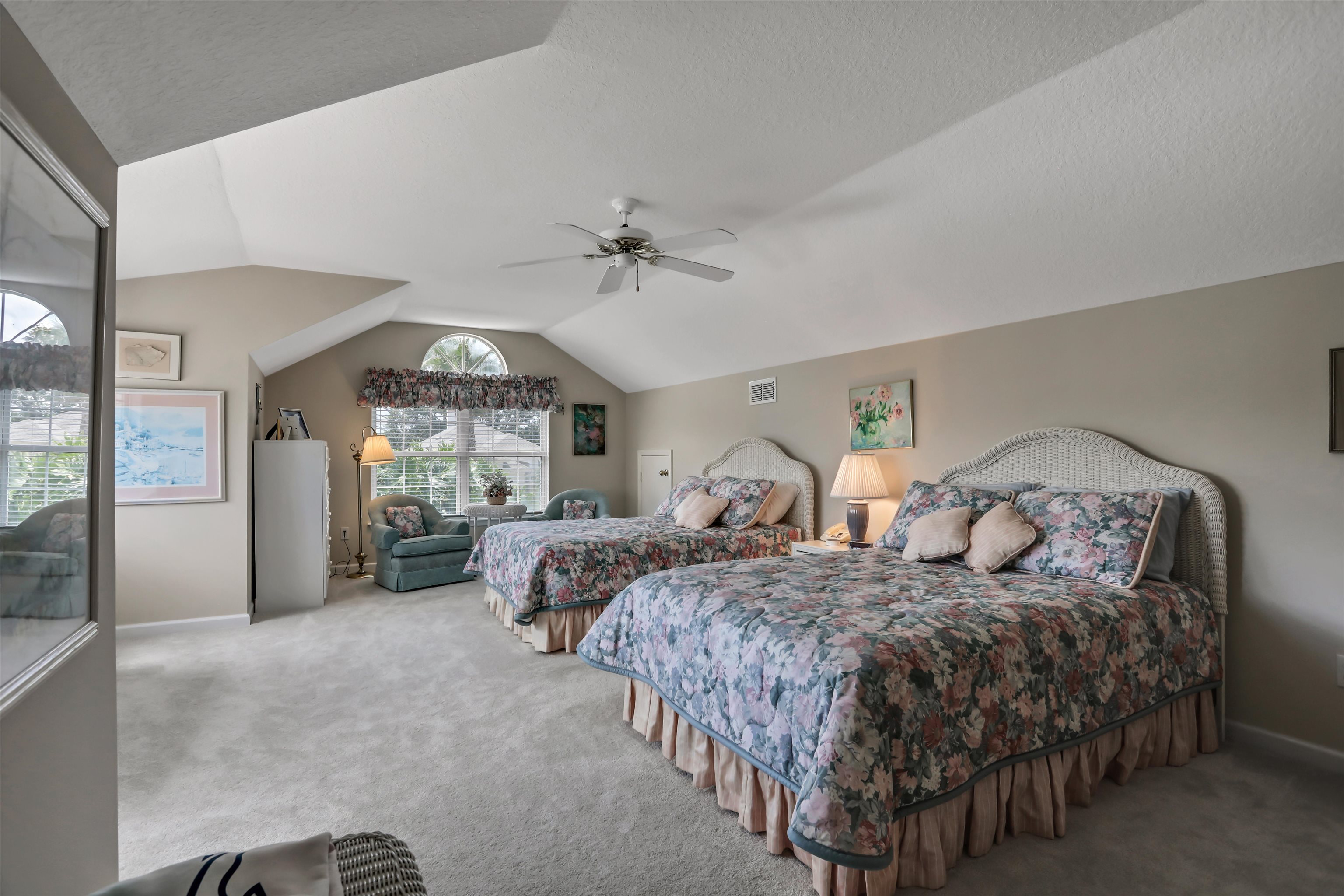904 Birdie Way St. Augustine, FL 32080 - Photo 12 of 21 a spacious bedroom with two beds and a large window