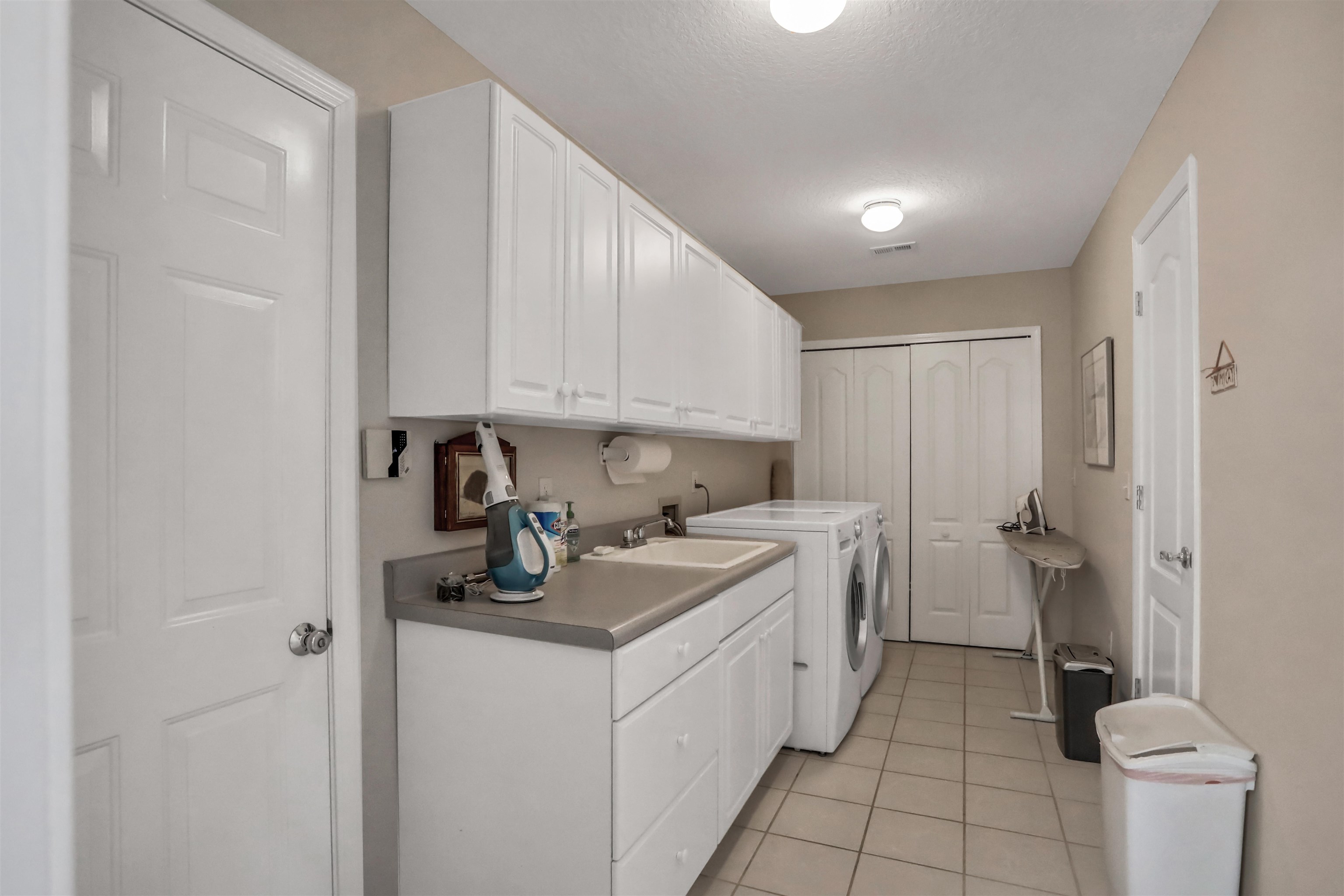 904 Birdie Way St. Augustine, FL 32080 - Photo 16 of 21 a kitchen with a sink stove and cabinets
