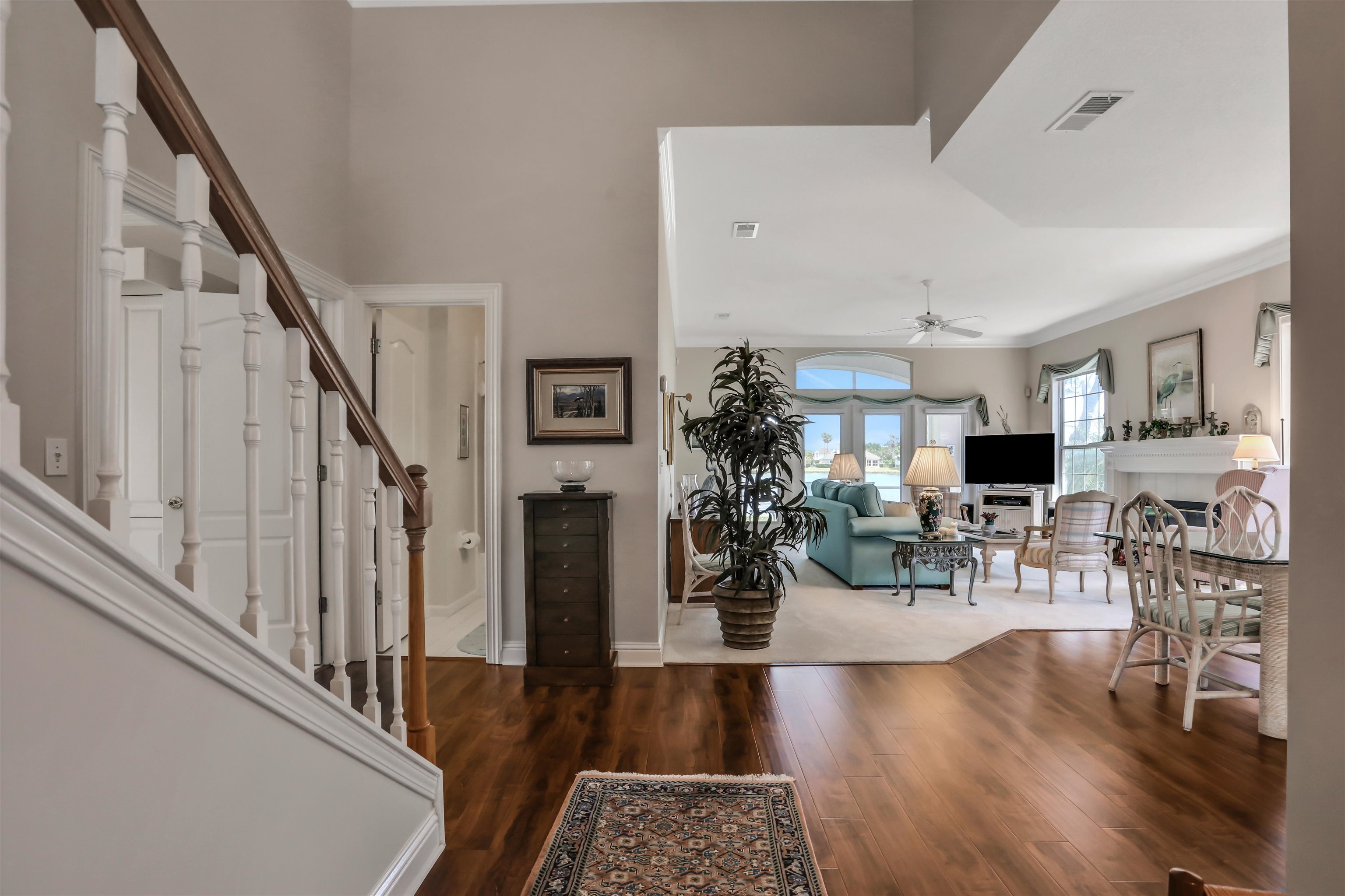 904 Birdie Way St. Augustine, FL 32080 - Photo 2 of 21 a living room with furniture and wooden floor