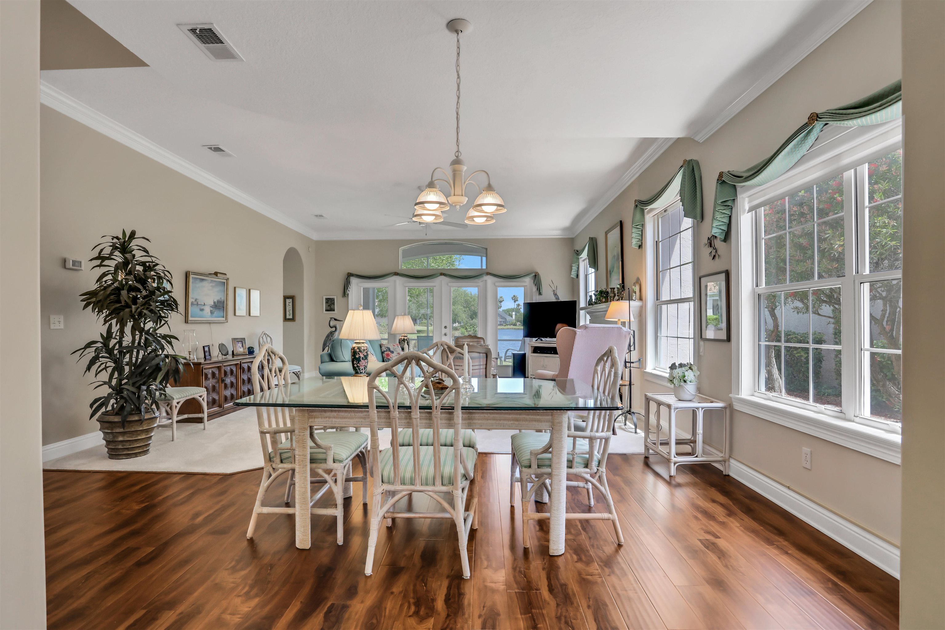 904 Birdie Way St. Augustine, FL 32080 - Photo 5 of 21 a view of a dining room with furniture window and wooden floor
