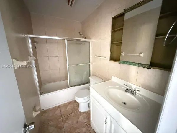 a bathroom with a sink and toilet