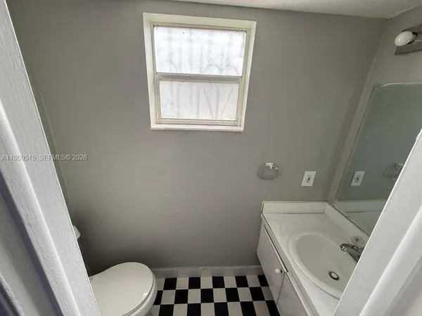 a bathroom with a sink and a toilet