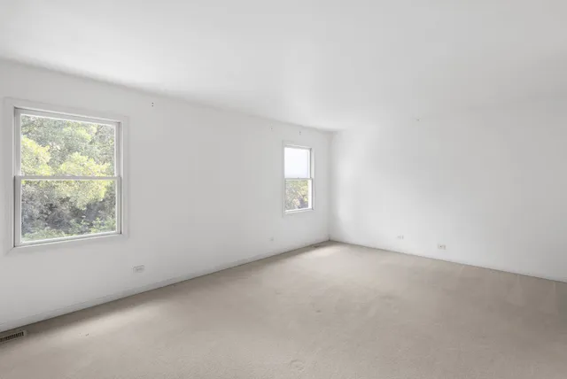 an empty room with windows