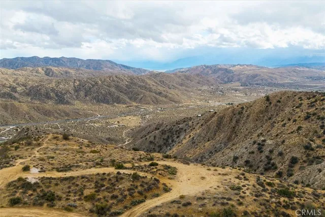 a view of mountain view with mountains in the background