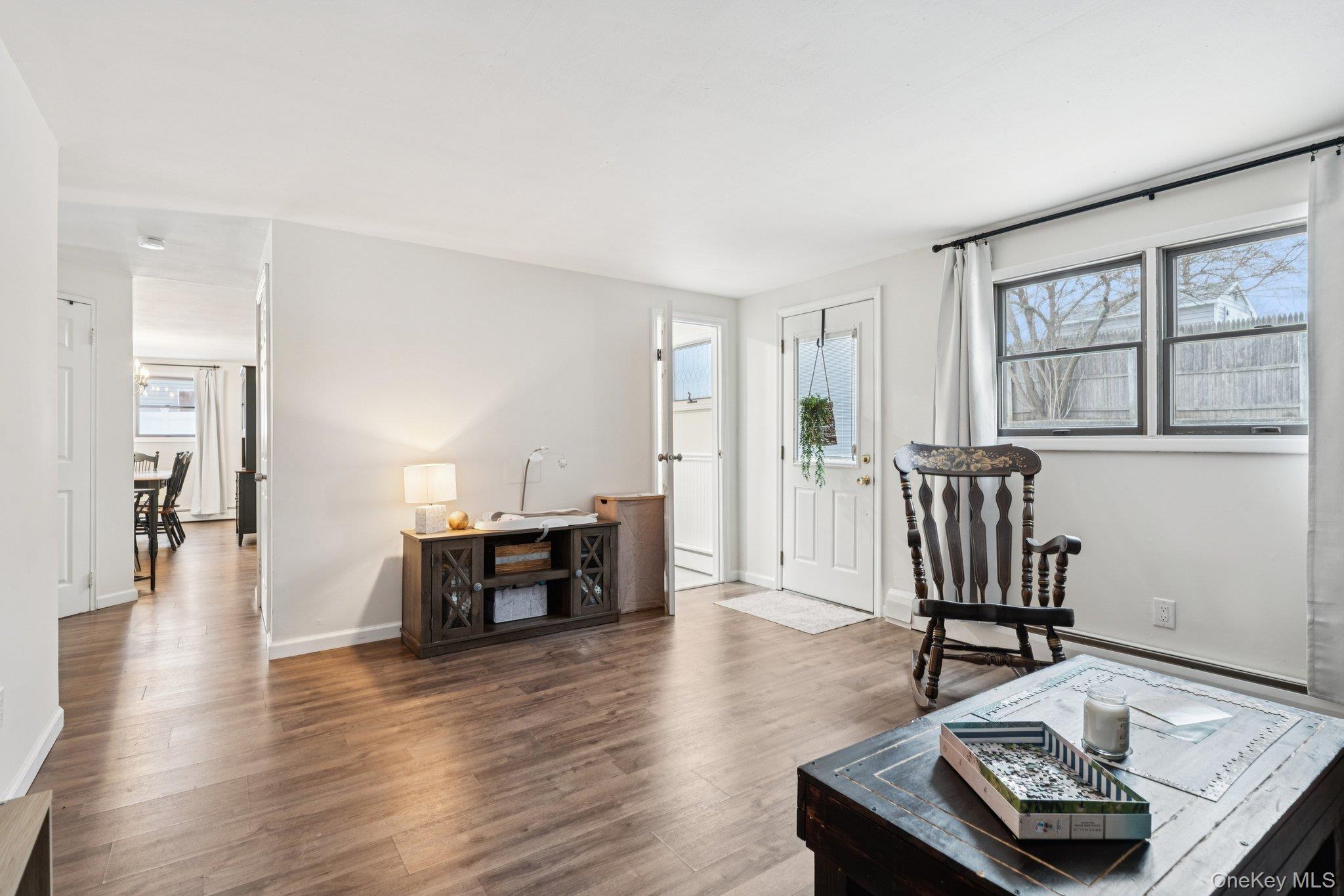 25 Wilson Street Centereach, NY 11720 - Photo 14 of 27 a living room with furniture and a table