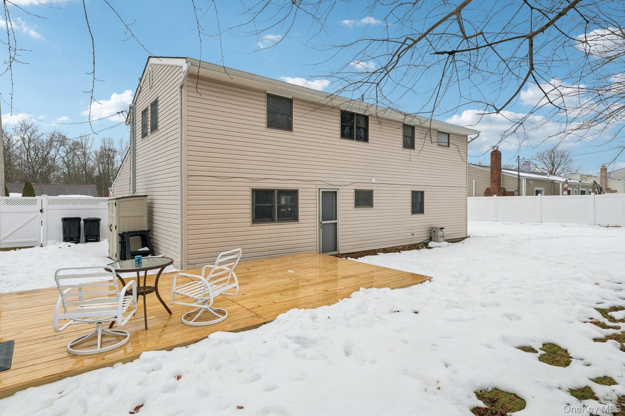 25 Wilson Street Centereach, NY 11720 - Photo 24 of 27 a view of a backyard with a patio