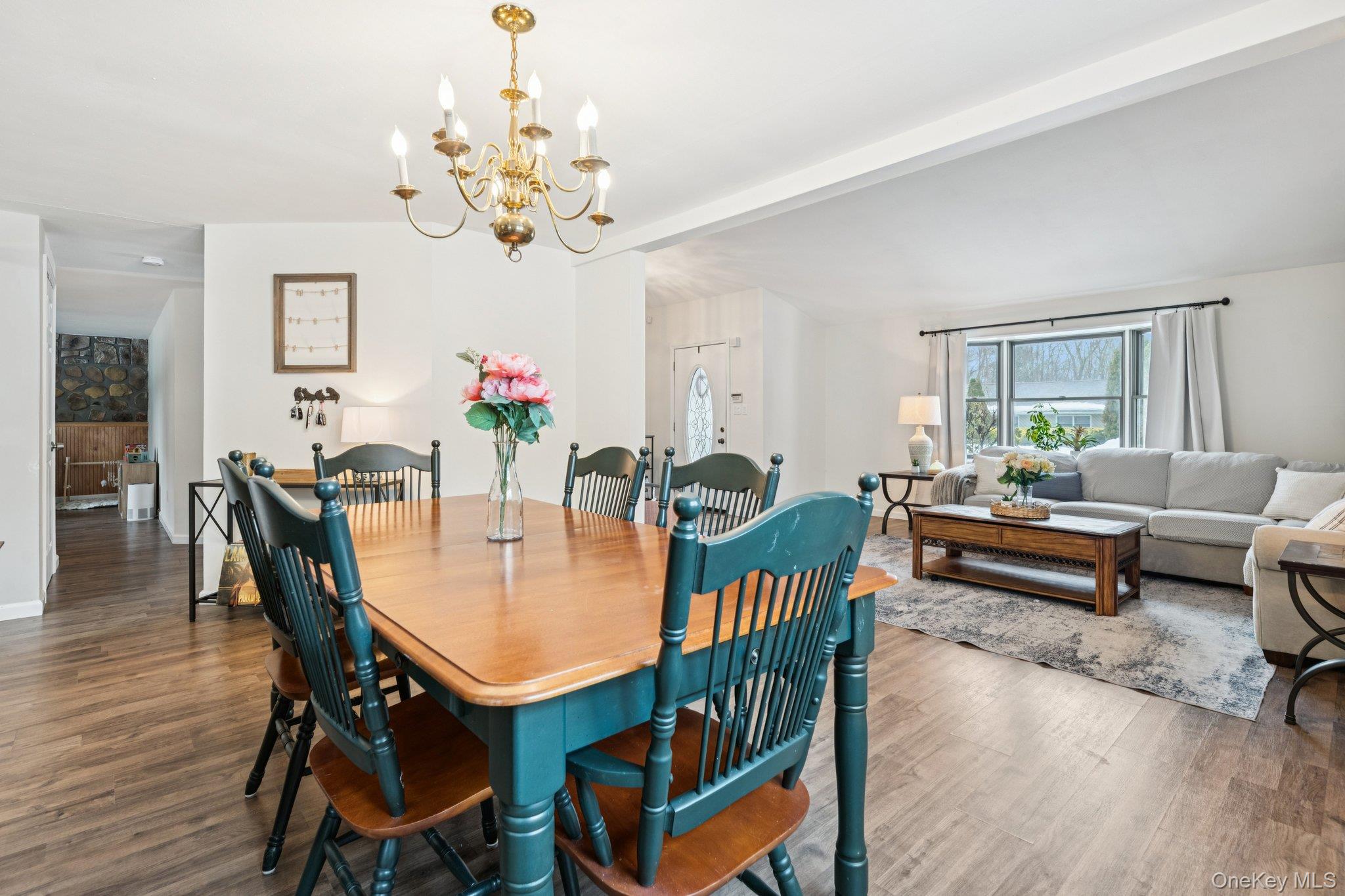 25 Wilson Street Centereach, NY 11720 - Photo 9 of 27 a view of a dining room with furniture and a chandelier