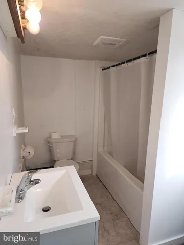 a bathroom with a sink and toilet
