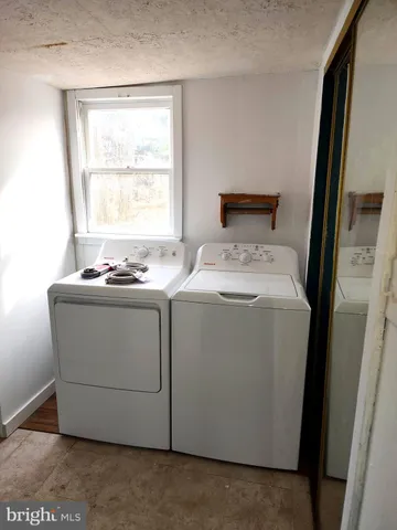 a utility room with washer and dryer