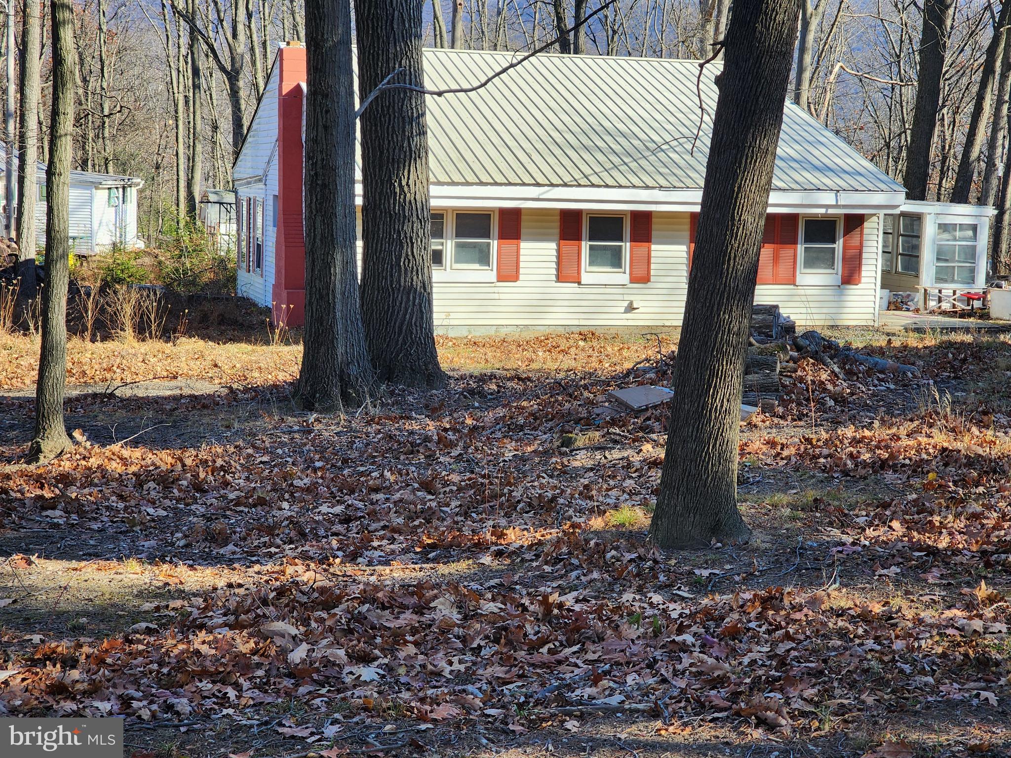 15689 Ridge Road Fort Loudon, PA 17224 - Photo 4 of 24 a front view of a house with a yard