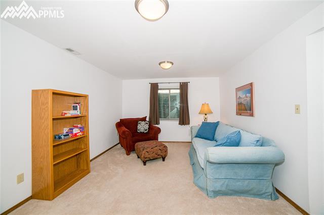 2040 Springcrest Road Colorado Springs, CO 80920 - Photo 9 of 27 Family room/rec room in basement