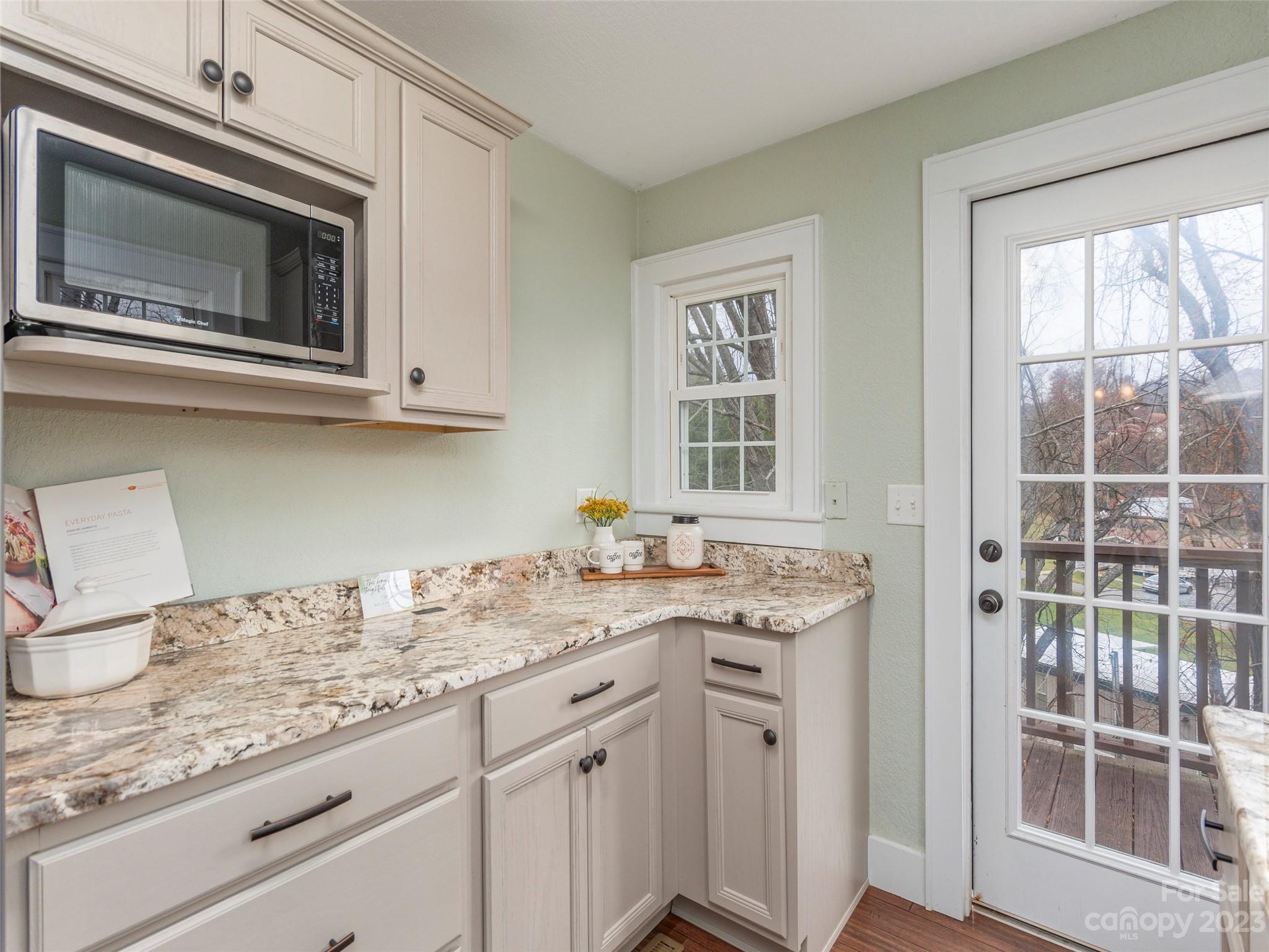 2117 Old Clyde Road Clyde, NC 28721 - Photo 11 of 24 a kitchen with a sink and a microwave