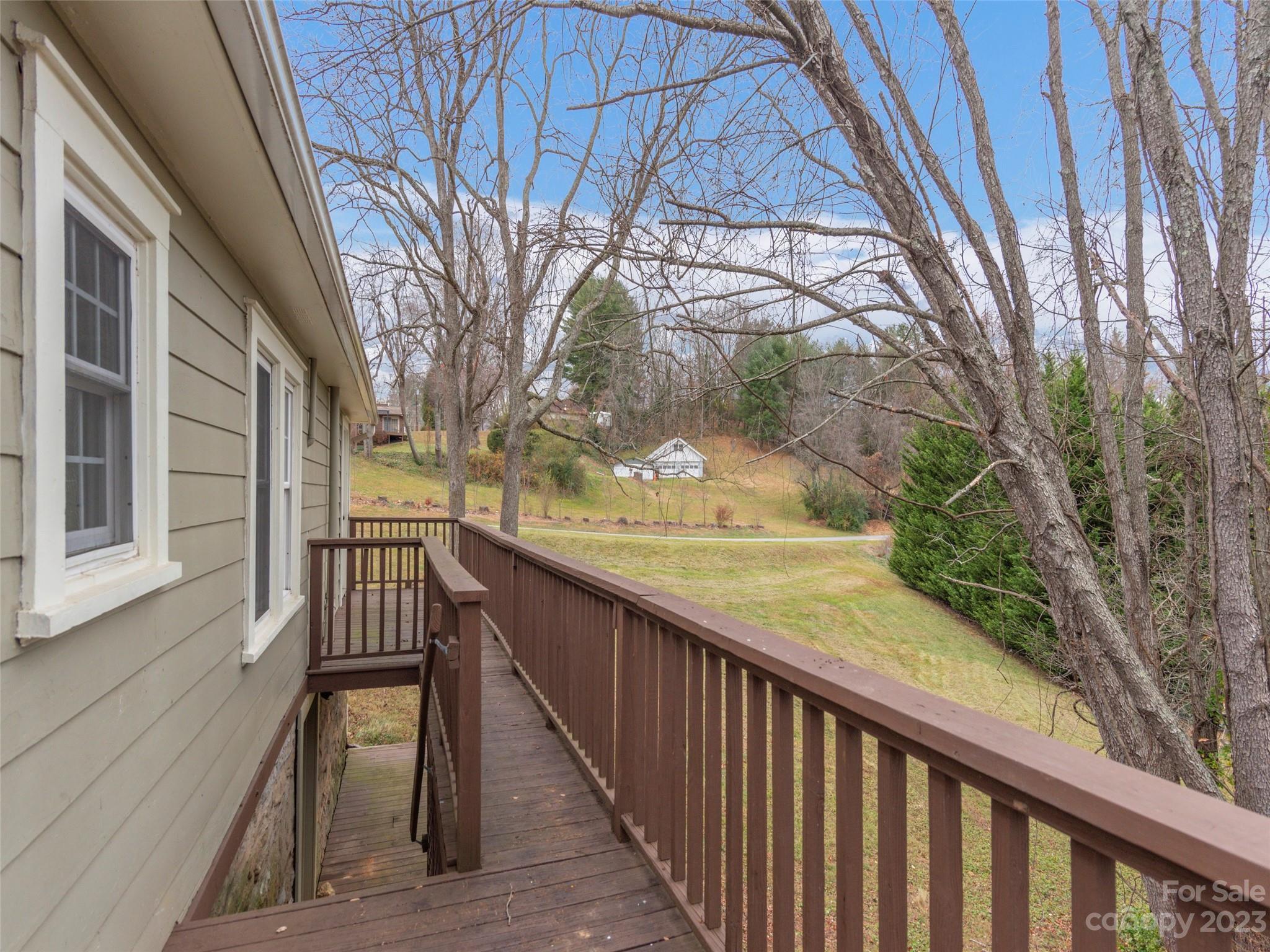 2117 Old Clyde Road Clyde, NC 28721 - Photo 21 of 24 a view of balcony with wooden floor and fence