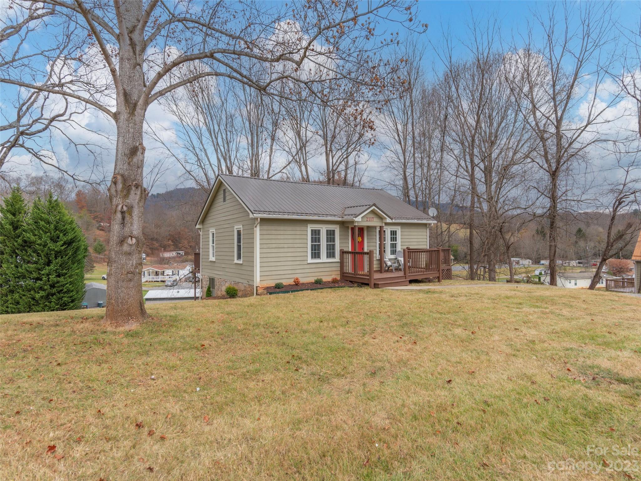 2117 Old Clyde Road Clyde, NC 28721 - Photo 23 of 24 a front view of a house with a yard and garage