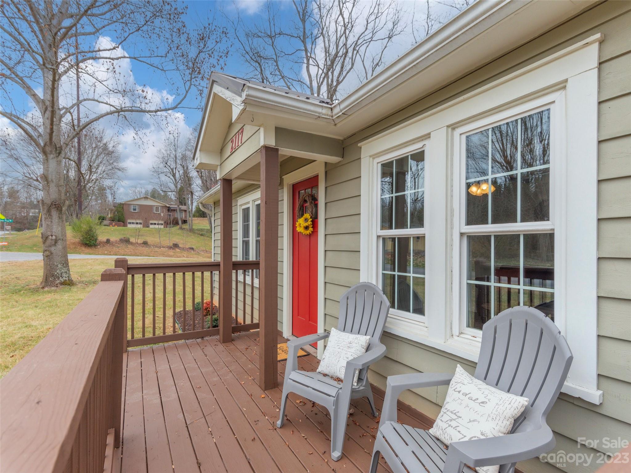 2117 Old Clyde Road Clyde, NC 28721 - Photo 8 of 24 a view of a chair and tables in the balcony