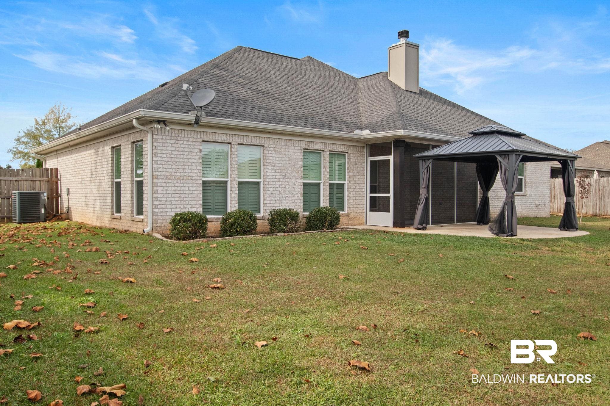 17376 Bankhead Boulevard Fairhope, AL 36532 - Photo 59 of 73 Rear view of house featuring brick siding, a patio area, a chimney, a gazebo, and a shingled roof
