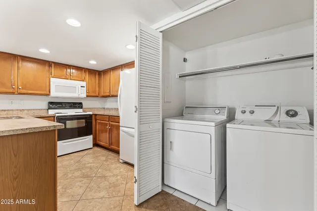 a kitchen with a sink a stove and cabinets