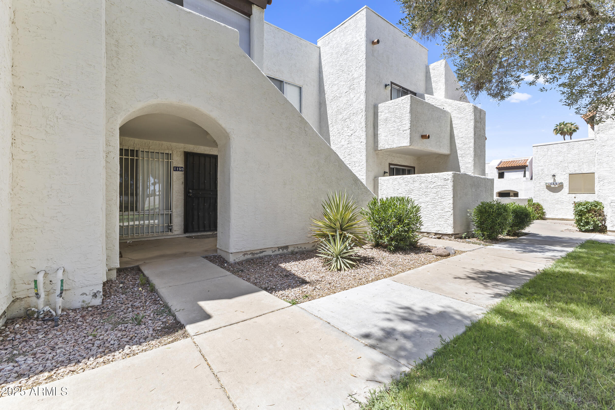 4730 West Northern Avenue, Unit 1158 Glendale, AZ 85301 - Photo 2 of 23 a view of a house with a patio
