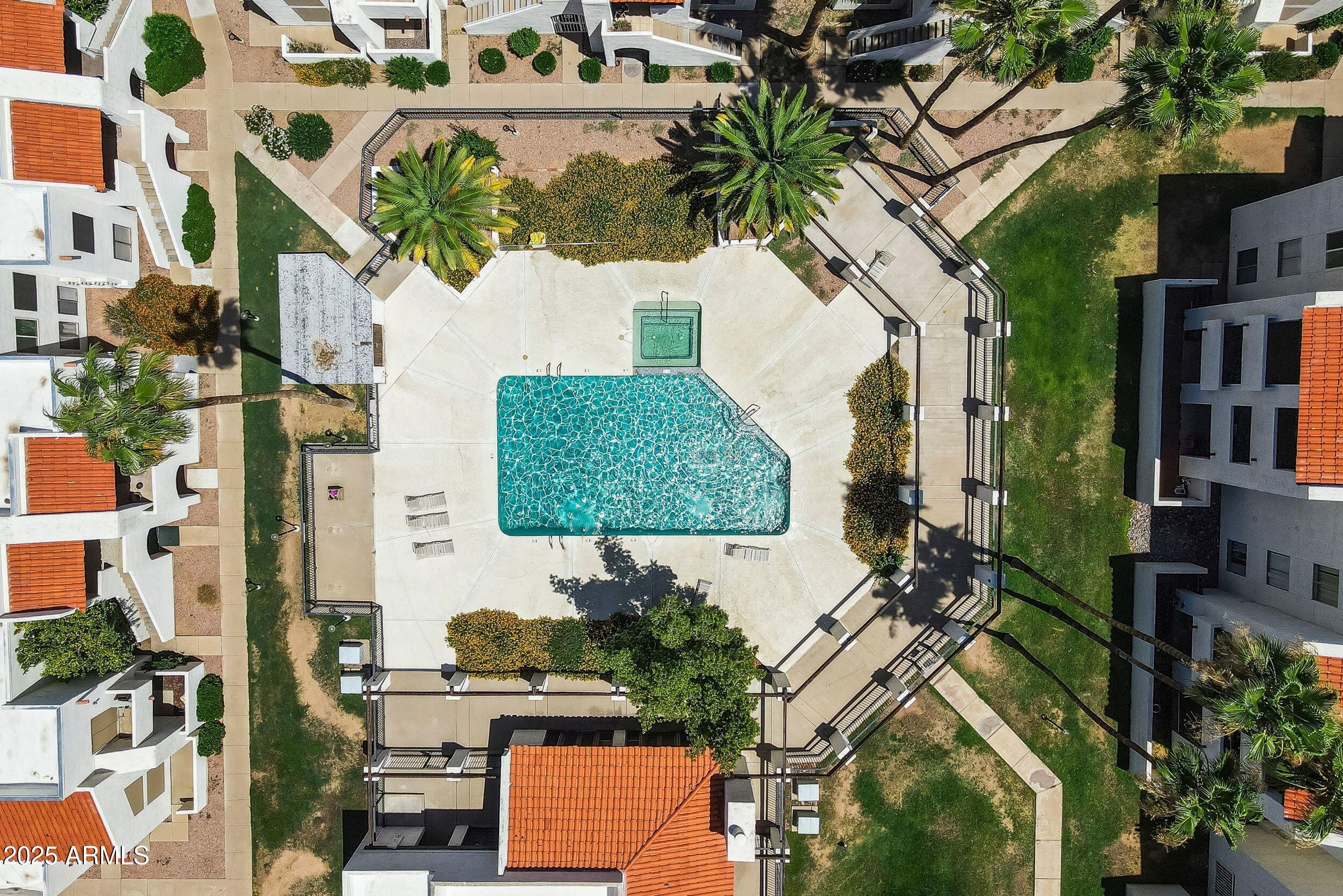 4730 West Northern Avenue, Unit 1158 Glendale, AZ 85301 - Photo 22 of 23 an aerial view of multiple houses with yard