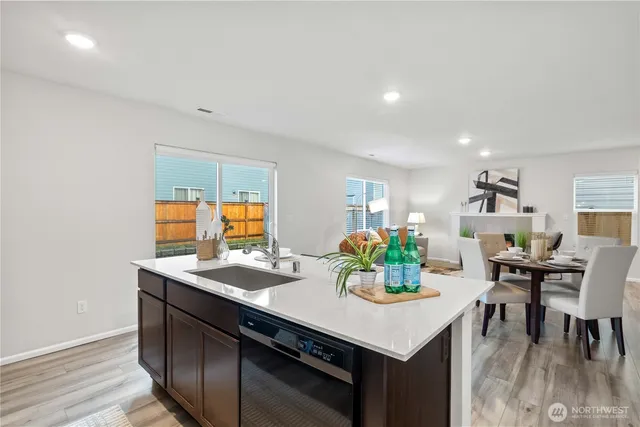 a kitchen with a table and chairs in it