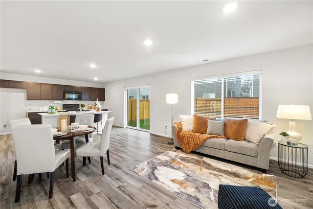 a living room with furniture and a table