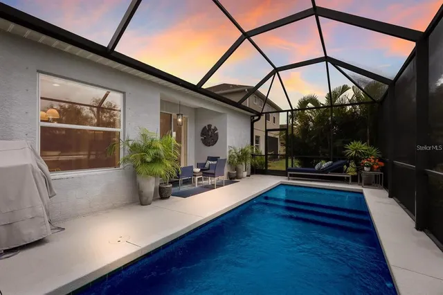 a view of a house with a small yard and plants