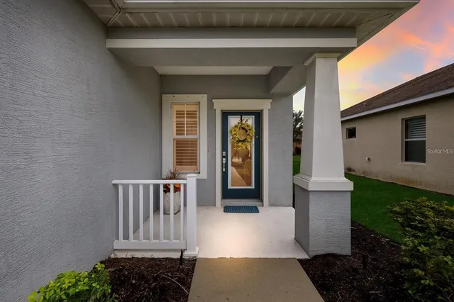 a view of porch with a bench