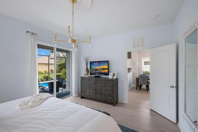 a view of a patio with table and chairs under an umbrella