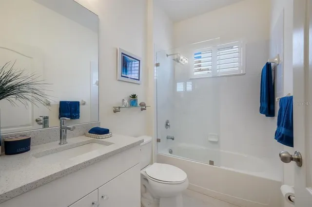 a view of a backyard with a patio and plants