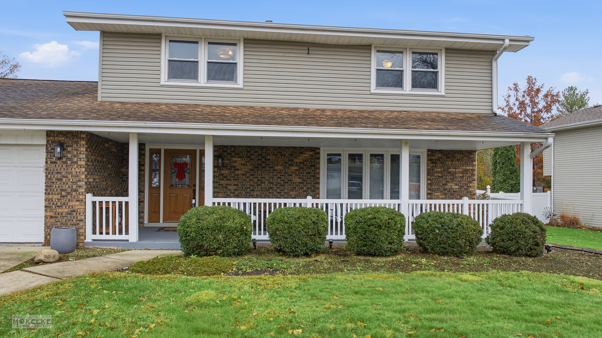 a view of a house with a yard and a large window